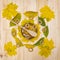 Bashkir honey on wooden table decorated with leaves served in a bowl with a wooden spoon and bagels