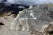 Basic sign painted on a rock, directions for Dingboche and Periche, Everest Base Camp trek, Nepal