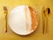 The basic table setting has a dinner plate, fork, knife, and spoon