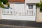 Basic white suburb metal aluminum house gate and slats street home