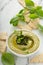 Basil hummus topped with pesto