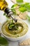 Basil hummus topped with pesto