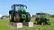 Basiliano, Italy. November 8, 2020. Two brand new John Deere tractors, on display outside the local dealer of the american company