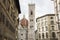 Basilica di Santa Maria del Fiore with Giotto campanile tower bell and Baptistery of San Giovanni. View from street of Florence,