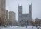 Basilica of Notre-Dame of Montreal and Place d`Armes during a snowstorm - Montreal, Quebec, Canada