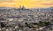 Basilica of the Sacred Heart on the summit of Montmartre seen from the Eifel Tower at sunset in Paris, France