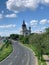 Basilica of Saint Mary in a distance with trees by asphalt road in Minneapolis, Minnesota