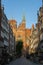 Basilica of St Mary in the old street with nearby buildings in Gdansk, Poland