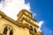 Basilica Virgen de la Caridad against the blue sky. Roman Catholic cathedral dedicated to the Blessed Virgin Mary. El Cobre,