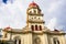 Basilica Virgen de la Caridad against the blue sky. Roman Catholic cathedral dedicated to the Blessed Virgin Mary. El Cobre,