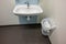 Basin and garbage bin in public toilet in Sweden