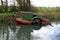 Basingstoke canal weedcutting boat