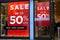 Basingstoke, UK - January 04 2017: Shop fronts of UK fashion stores with 50% off Sale signs