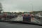 BASINGSTOKE, UK, May 25 2016: Traffic queueing as the lights change on a dull, rainy evening