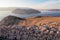 Baska - Panoramic sunrise view of deserted island Prvic seen from idyllic hiking trail near coastal town Baska