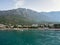Baska Voda, Croatia - July 25, 2021. Great panoramic view of the city and Biokovo Mountain from the sea. The main beach