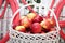 Basket with apples on the background of the bike. Studio decoration