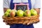 Basket of apples at fifty percent off held by employee