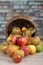 Basket of apples spilled on the table