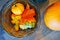 basket with artificial autumn leaves and pumpkins. Halloween decor.