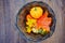 basket with artificial autumn leaves and pumpkins. Halloween decor.