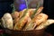 Basket with breads and sprigs of rosemary with blurs