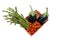 Basket with bunch of asparagus, tomato and aubergines isolated