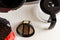 Basket coffee filter, drip-type coffee maker and coffee beans on the kitchen table, top view. Reusable metal mesh coffee filter