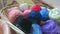 A basket of coloured cotton reels