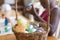 Basket of colourful eggs with african american girl painting in the background