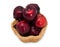 Basket of dark red apples on a white background