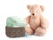 Basket with diapers, pacifier and teddy bear on white. Baby accessories