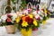 The basket of flowers. Arrangement of fresh flowers on the table. Flower shop. Flowers delivery on the house