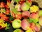 Basket of fresh apples, with colorful fall leaves