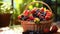 Basket of fresh mixed berries on a sunny terrace