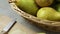 Basket with fresh picked ripe conference pears close up