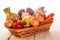 Basket with fresh vegetables on wihte rustic table