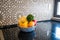 Basket of fruits on kitchen marble. Classical retro wall