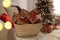 Basket full of gift boxes for Christmas advent calendar in room