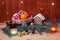 Basket with gingerbread cookies and fruits, little gingerbread house and glasses of mulled wine