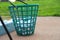 Basket of golf balls at driving range close up