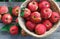 Basket with heap of apple harvest in fall garden