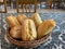 Basket of individual breads on a table o restaurant