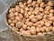 A basket of Irish potatoes fills up in a Lagos market.