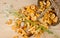 Basket of mushrooms and bouquet of camomiles