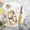 Basket with pink single-edged garlic on a gray marble background with ingredients for meat marinade on shish kebabs, bbq