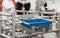 Basket or plastic box container on roller rack or aluminum shelf for easy transfer for industrial