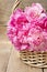 Basket of pretty pink peonies