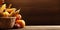 basket with pumpkins and corn crop cob on wooden table with wood blurred background, copy space for text