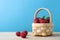 Basket of Raspberries against Blue Background